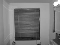 Blinds can help shut out cold air and keep heated air indoors in rooms where you may not want to put curtains up, like in this second floor half  bathroom.